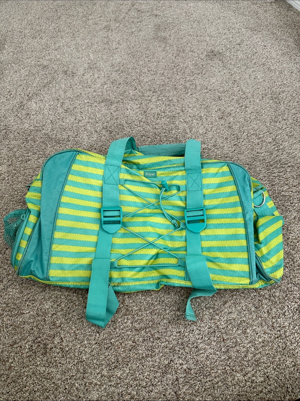 Thirty-One duffle bag featuring teal and lime green stripes